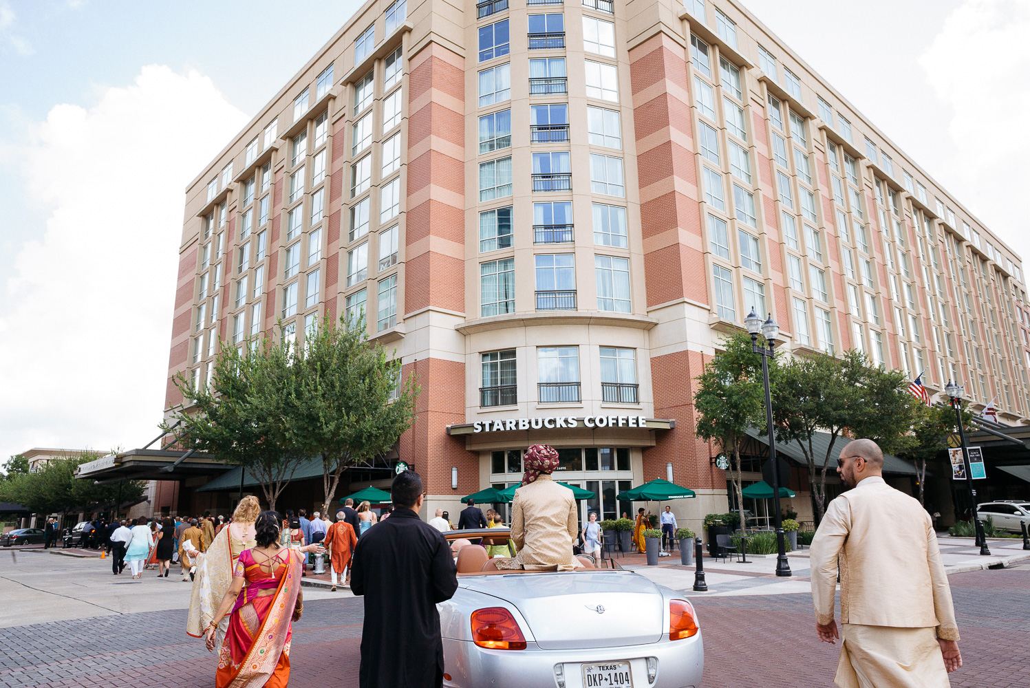 The Baraat with the Sugar Land Marriott in background Hindu Jewish fusion wedding Sugar Land Marriott Hotel Texas-041