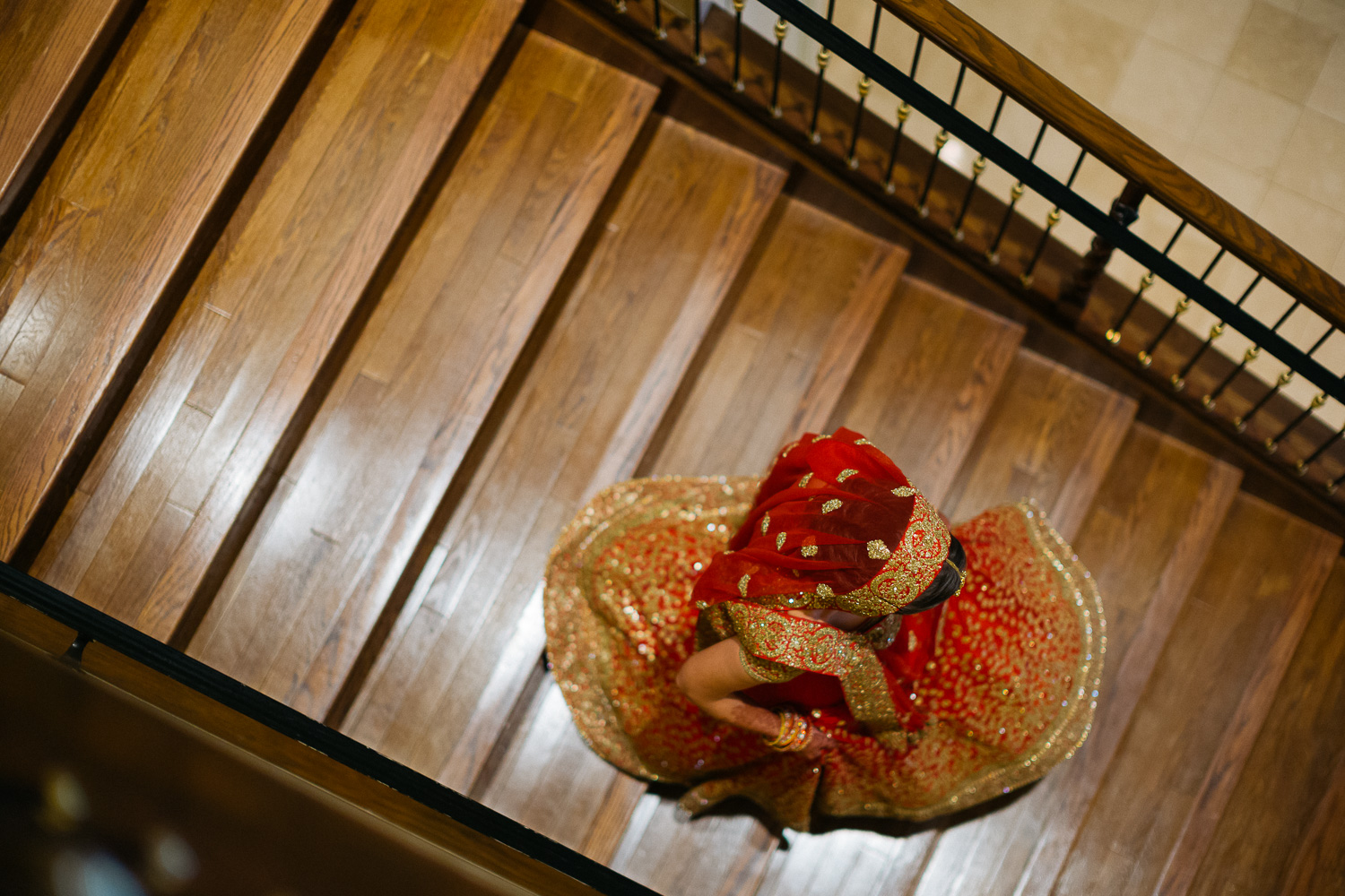 Bride descends staircase Hindu Jewish fusion wedding Sugar Land Marriott Hotel Texas-042