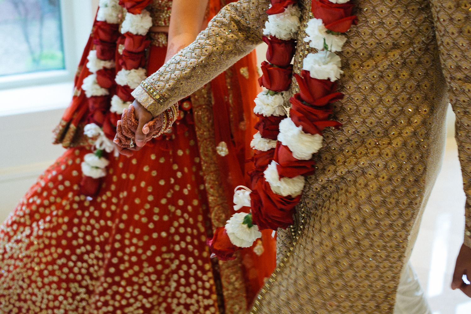 Holding hands Hindu Jewish fusion wedding Sugar Land Marriott Hotel Texas-052