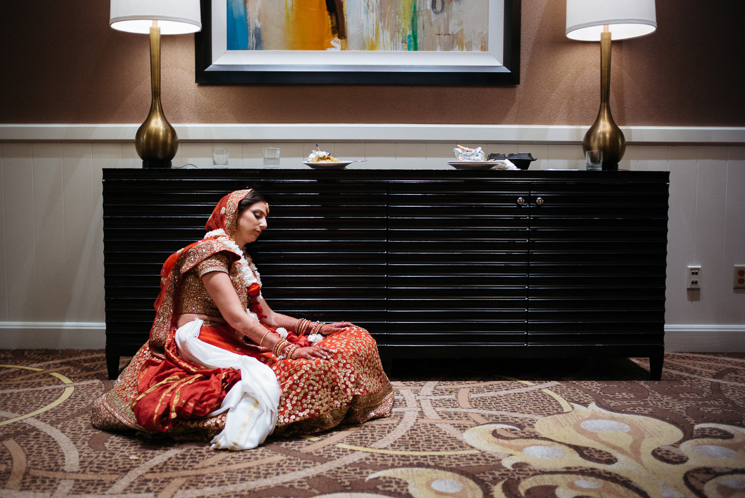 A resting bride at hotel Hindu Jewish fusion wedding Sugar Land Marriott Hotel Texas-053