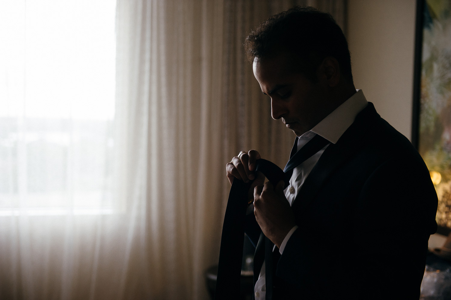 Groom getting ready in hotel room Hindu Jewish fusion wedding Sugar Land Marriott Hotel Texas-058