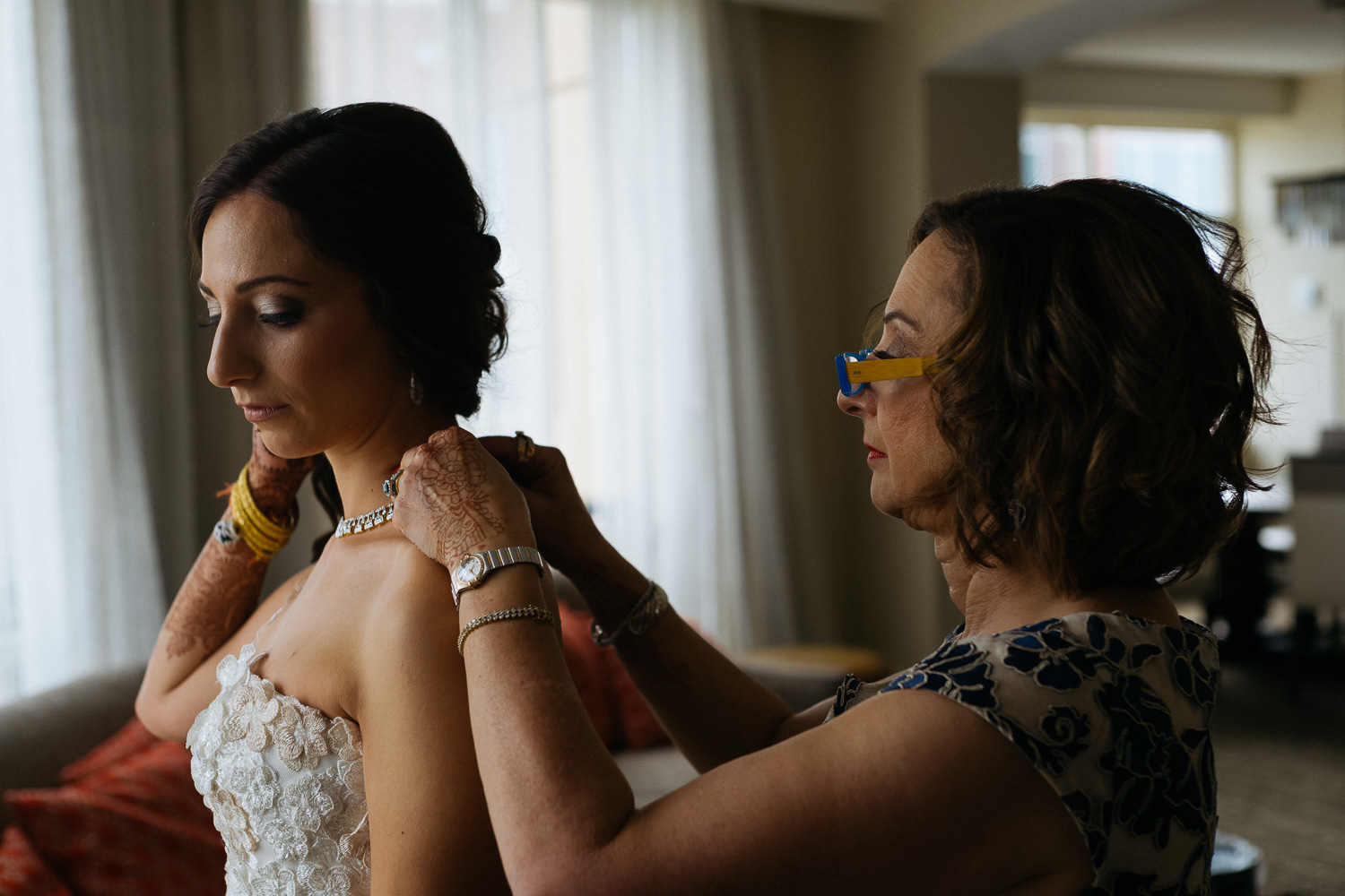 Mother of the bride fixes brides dress Hindu Jewish fusion wedding Sugar Land Marriott Hotel Texas-060