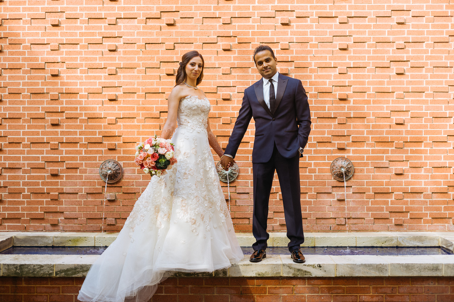 Hindu-Jewish fusion wedding Just married couple Hindu Jewish fusion wedding Bride and groom pose for the camera at Sugar Land Marriott Hotel Hindu Jewish fusion wedding Sugar Land Marriott Hotel Texas-064