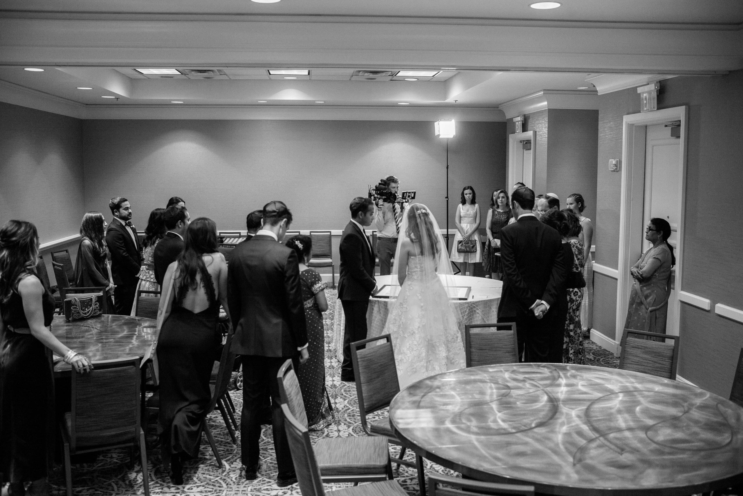 Friends and family gathered before ceremony to sign the ketubah Hindu Jewish fusion wedding Sugar Land Marriott Hotel Texas-065