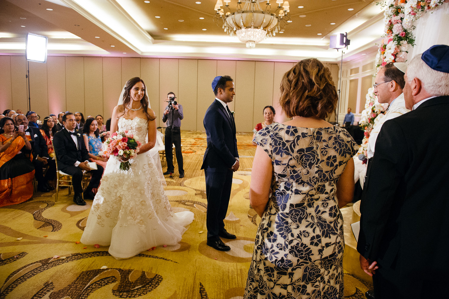 Bride cirlces groom seven times The custom of circling the groom is explained in many ways: o The book of Jeremiah states that “A woman encompasses a man” [31:22]. Hindu Jewish fusion wedding Sugar Land Marriott Hotel Texas-070