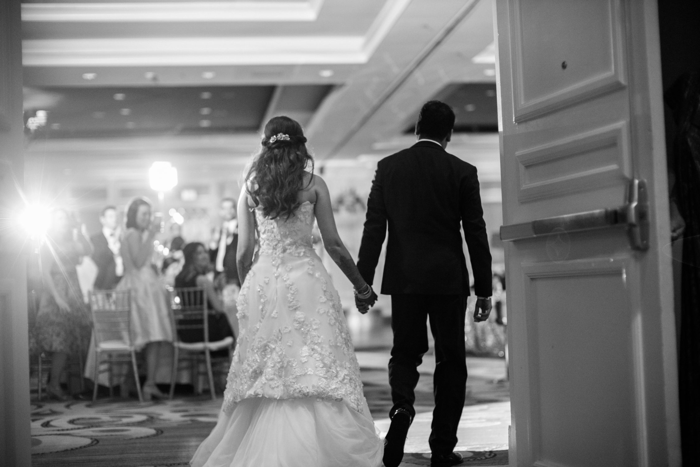 Couple reception entrance Hindu Jewish fusion wedding Sugar Land Marriott Hotel Texas-079