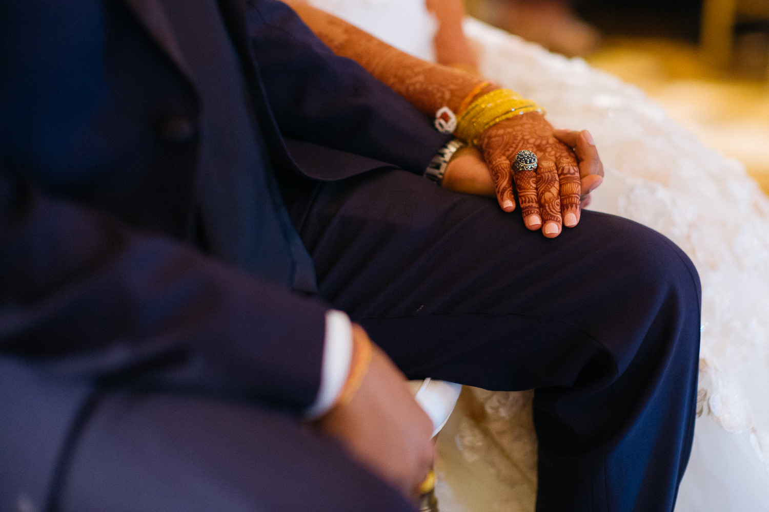 Couple holding hands during toast Hindu Jewish fusion wedding Sugar Land Marriott Hotel Texas-083