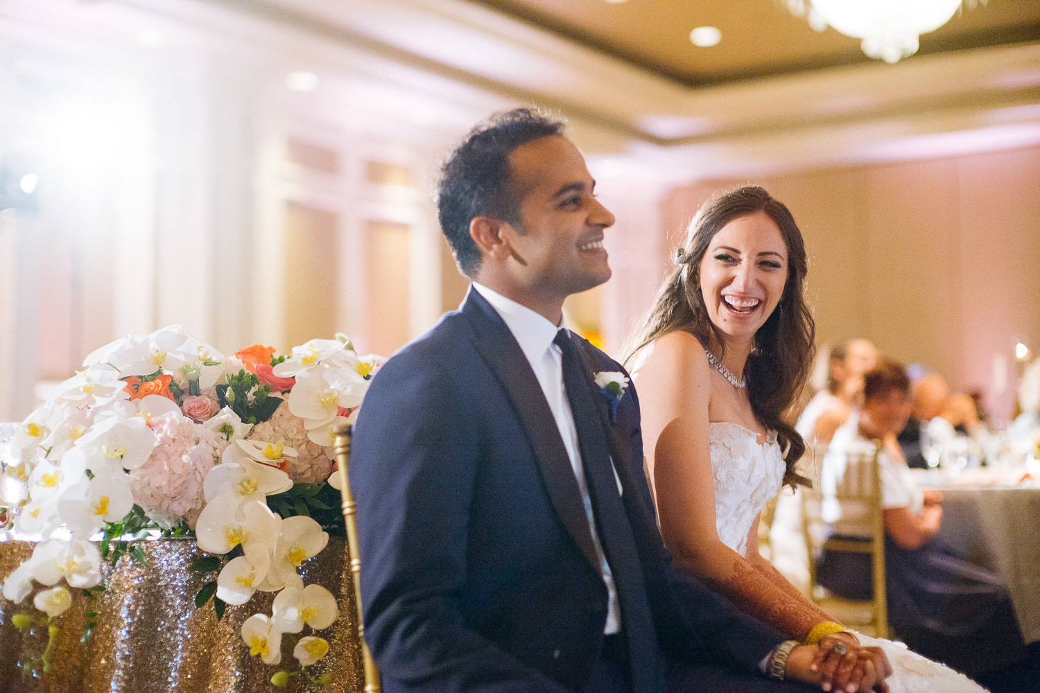 During wedding toasts bride and groom laugh Hindu Jewish fusion wedding Sugar Land Marriott Hotel Texas-084