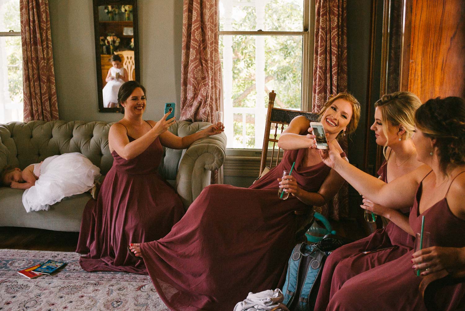 Bridesmaids sharing a joke as flower girl sleeps Barr Mansion Austin Wedding Photos-Philip Thomas