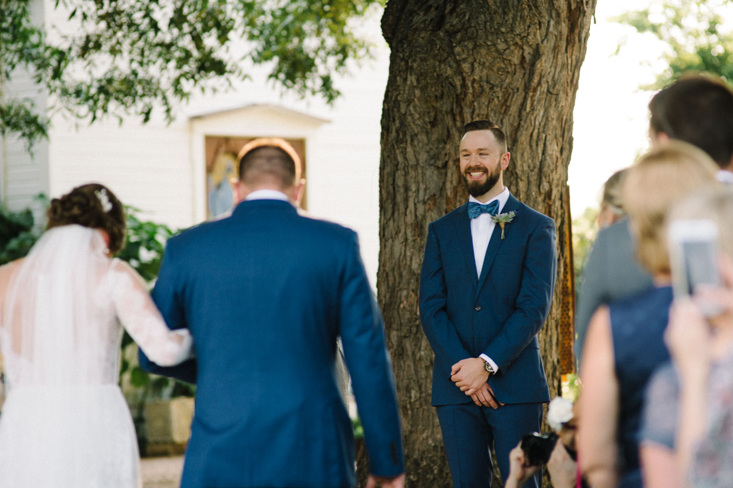 Bride with brother walk down the aisle Barr Mansion Austin Wedding Photos-Philip Thomas