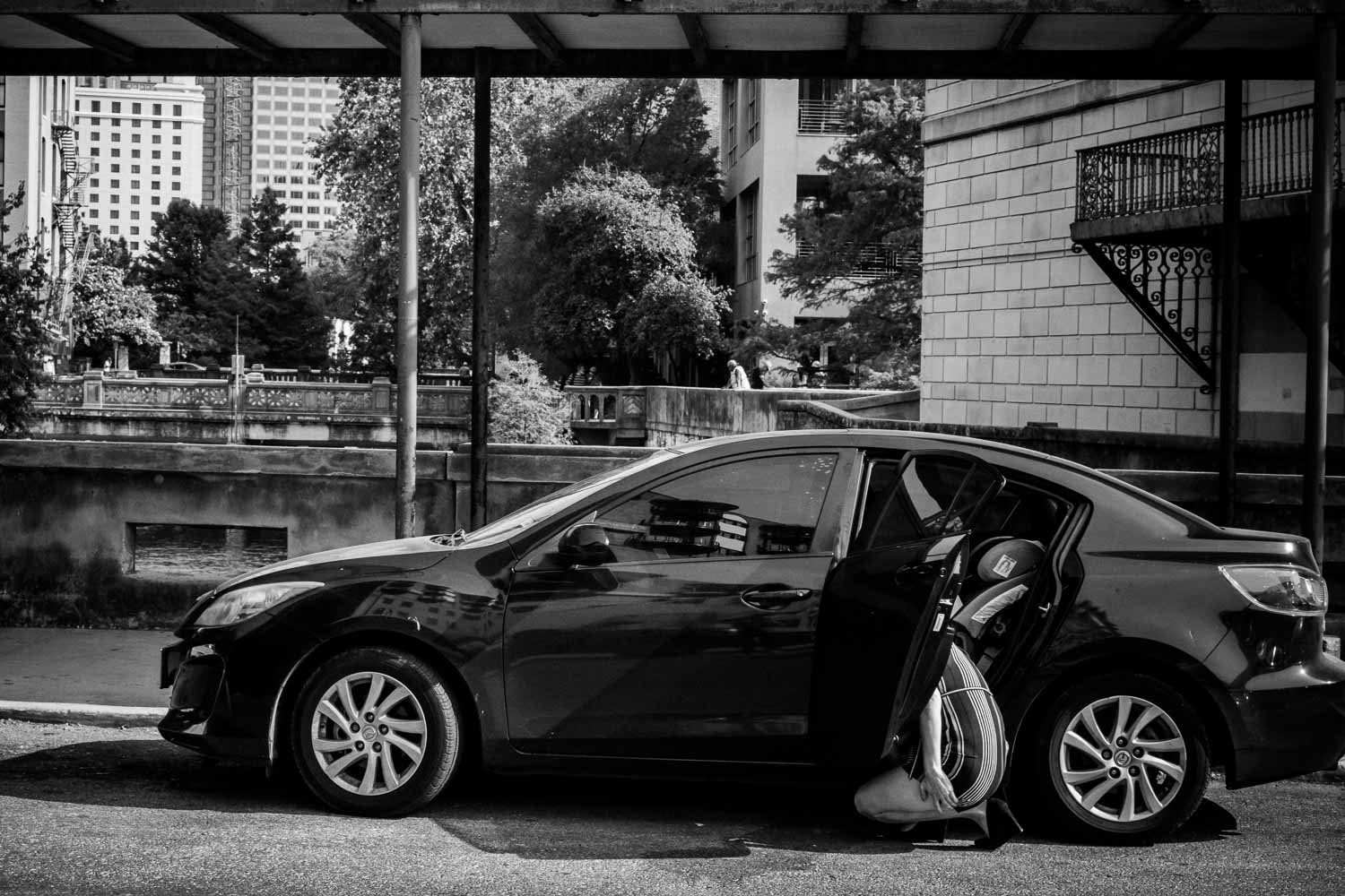 Lady exiting car along Main Plaza, San Antonio Street Photography-Philip Thomas