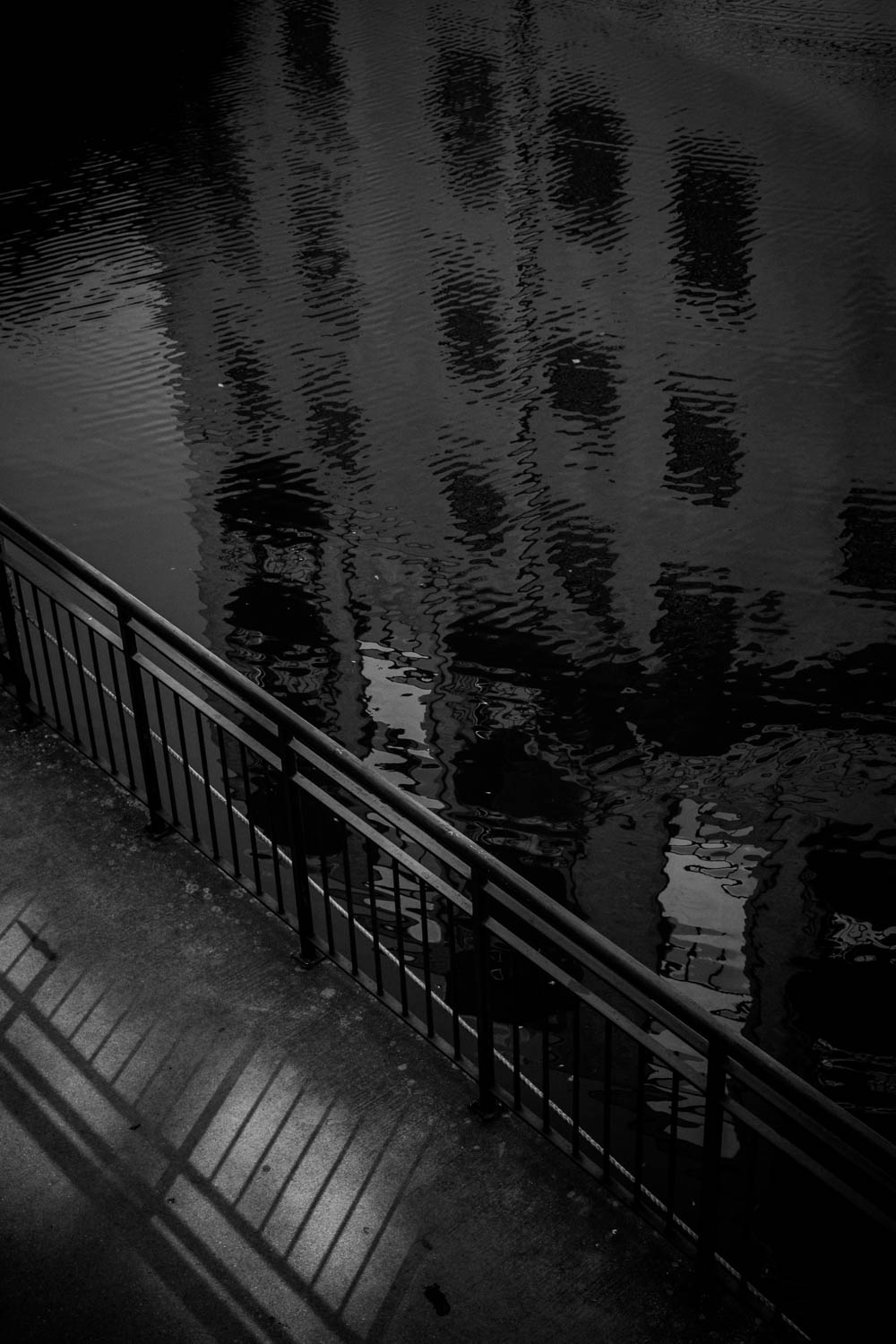 The San Antonio river reflect the river and a pathway at dusk