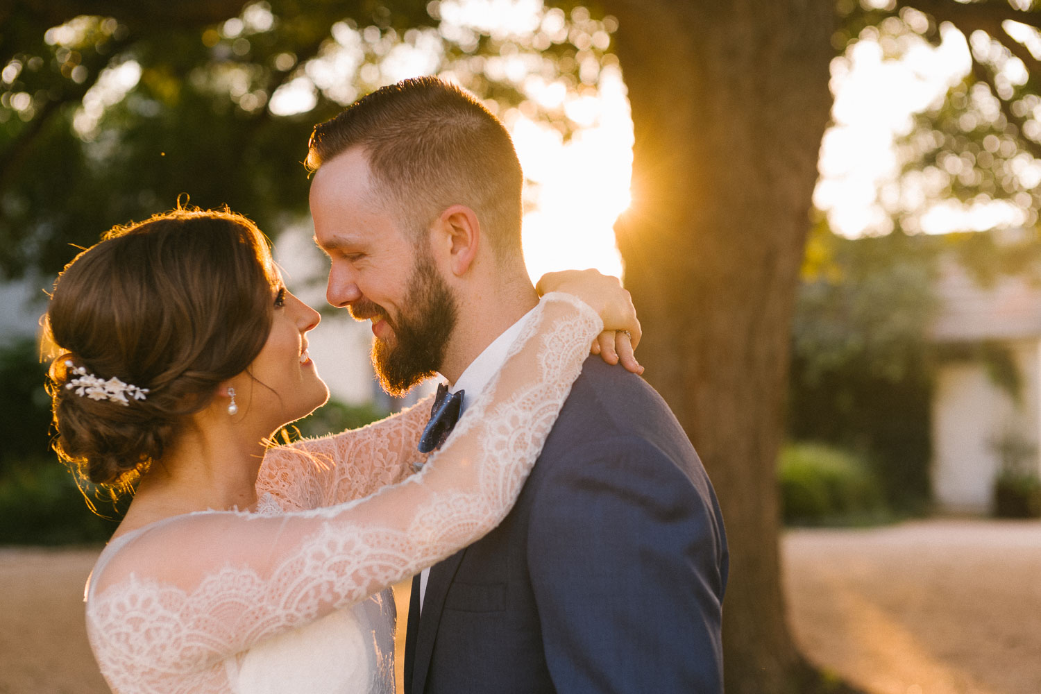 Married couple embrace at sunset Barr Mansion Austin Wedding Photos-Philip Thomas