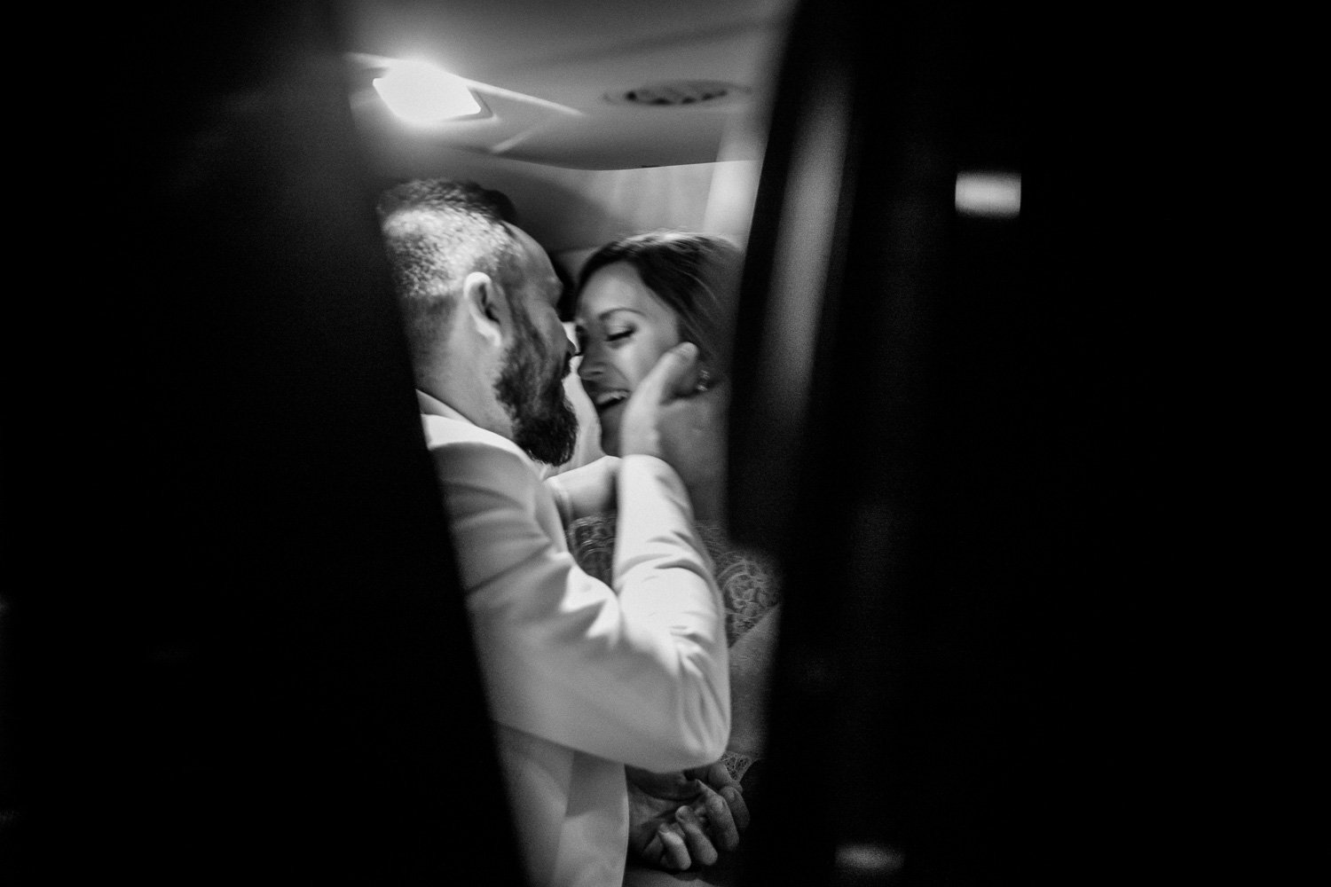 Couple kiss in getaway car-Barr Mansion Austin Wedding Photos-Philip Thomas