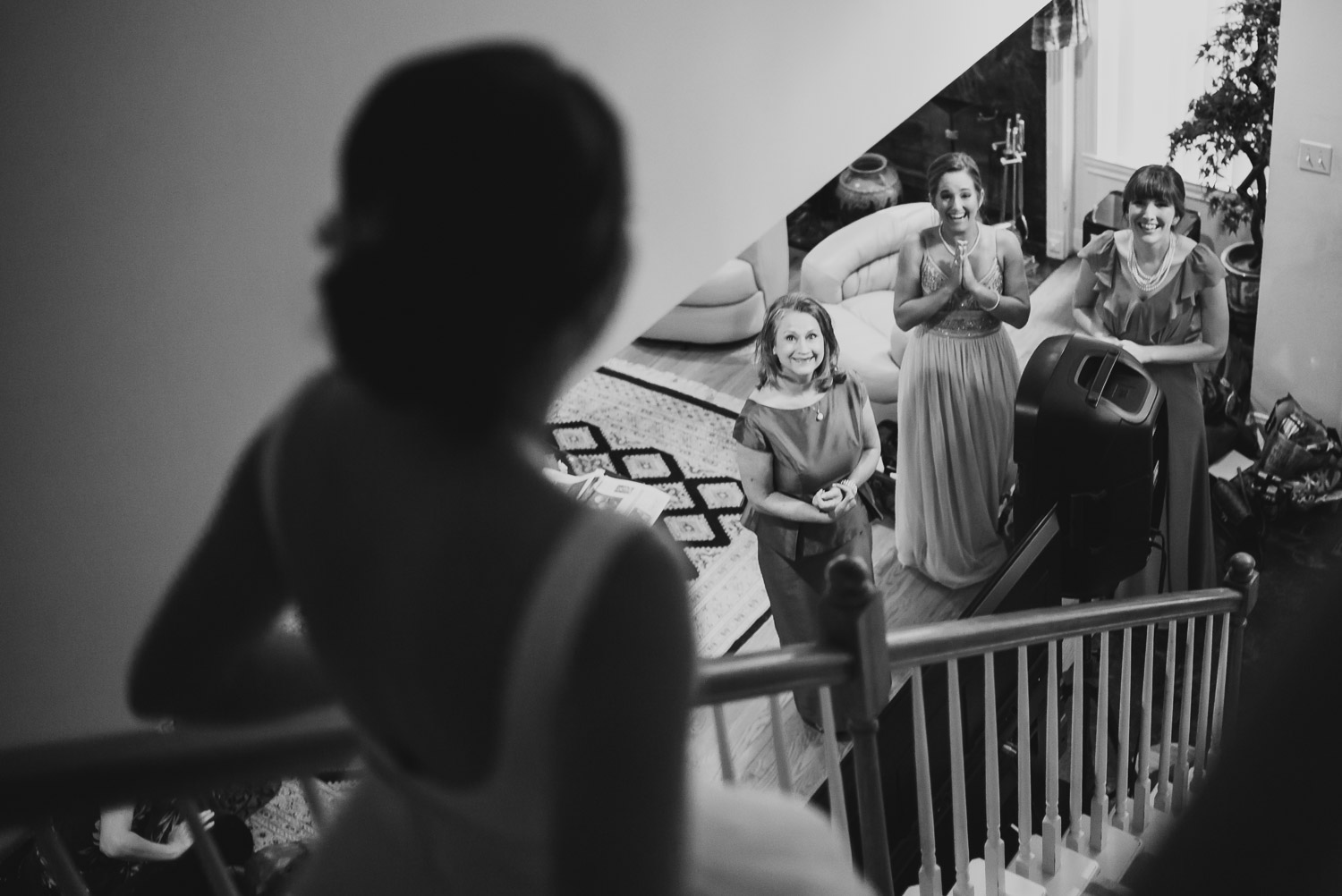 bride walks down parents staircase to the delight of friends and family -Cherie Flores Garden Pavilion Wedding Hermann Park Houston Texas-Philip Thomas