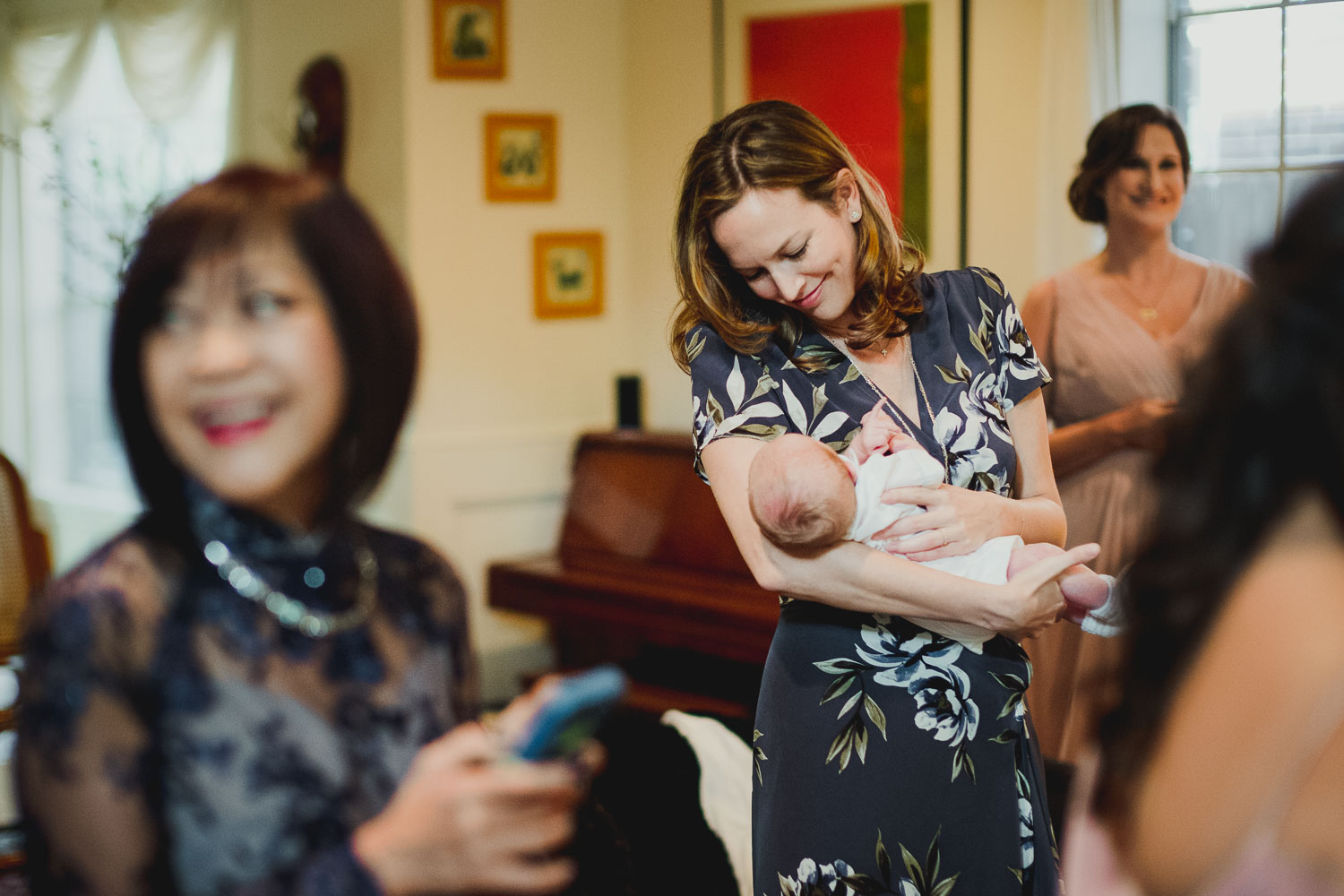 Parents and friends hold baby during geting ready for a wedding Cherie Flores Garden Pavilion Wedding Hermann Park Houston Texas-Philip Thomas