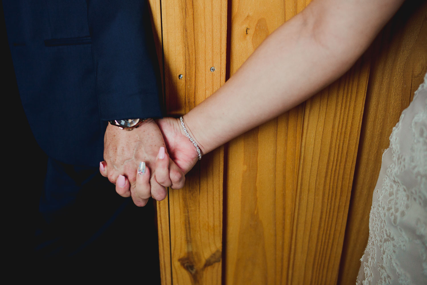 Couple holding hands at The Springs Event Venue Wedding Photos-Philip Thomas
