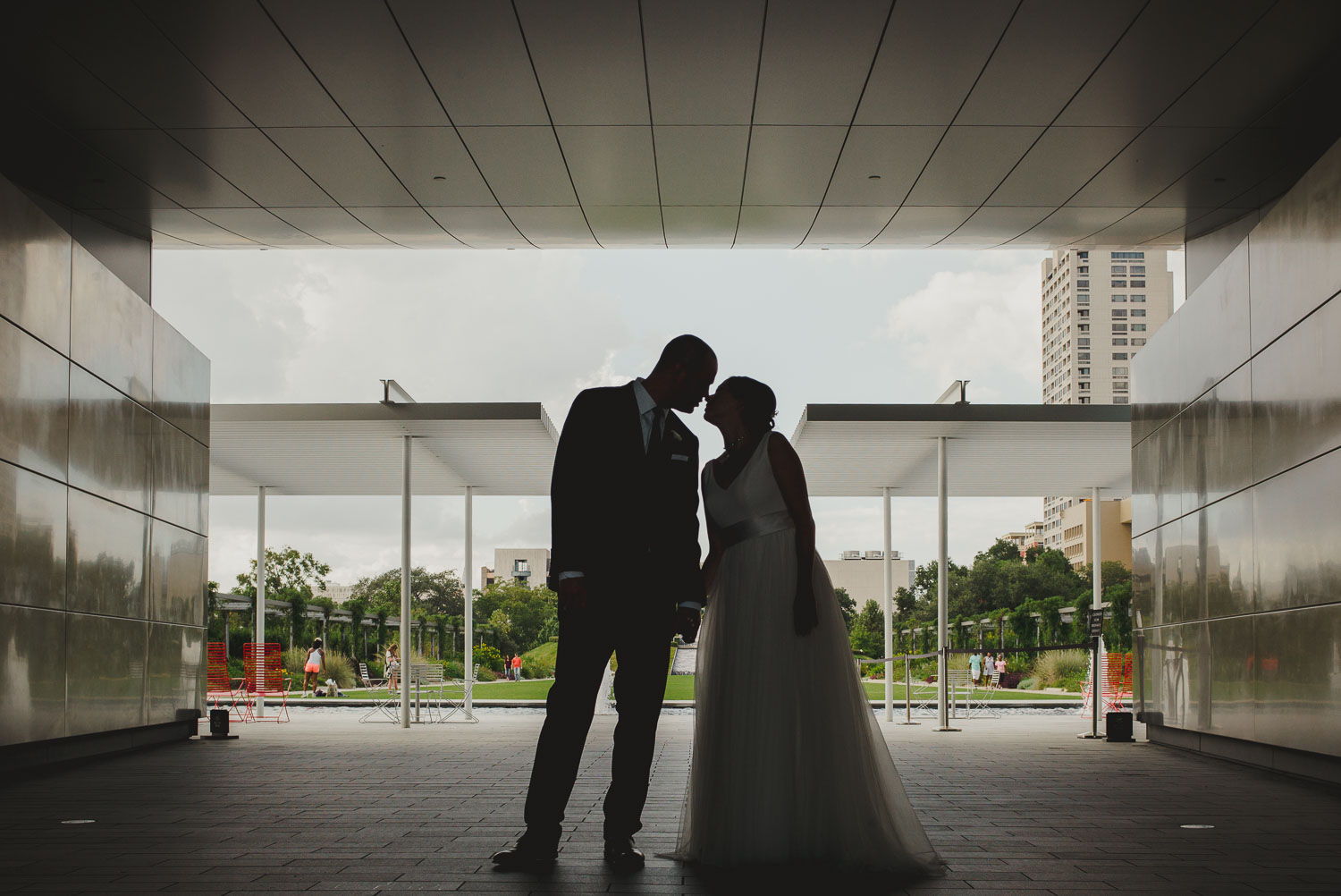 Couple kiss in silhouette Cherie Flores Garden Pavilion Wedding Hermann Park Houston Texas-Philip Thomas