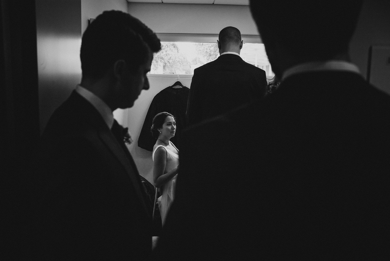 Bride surrounded by groomsmen in the waiting room Cherie Flores Garden Pavilion Wedding Hermann Park Houston Texas-Philip Thomas