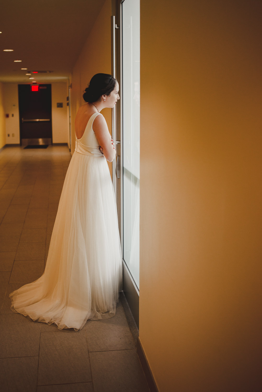 Bride peeks out hiding behind door to see guests lining up Cherie Flores Garden Pavilion Wedding Hermann Park Houston Texas-Philip Thomas