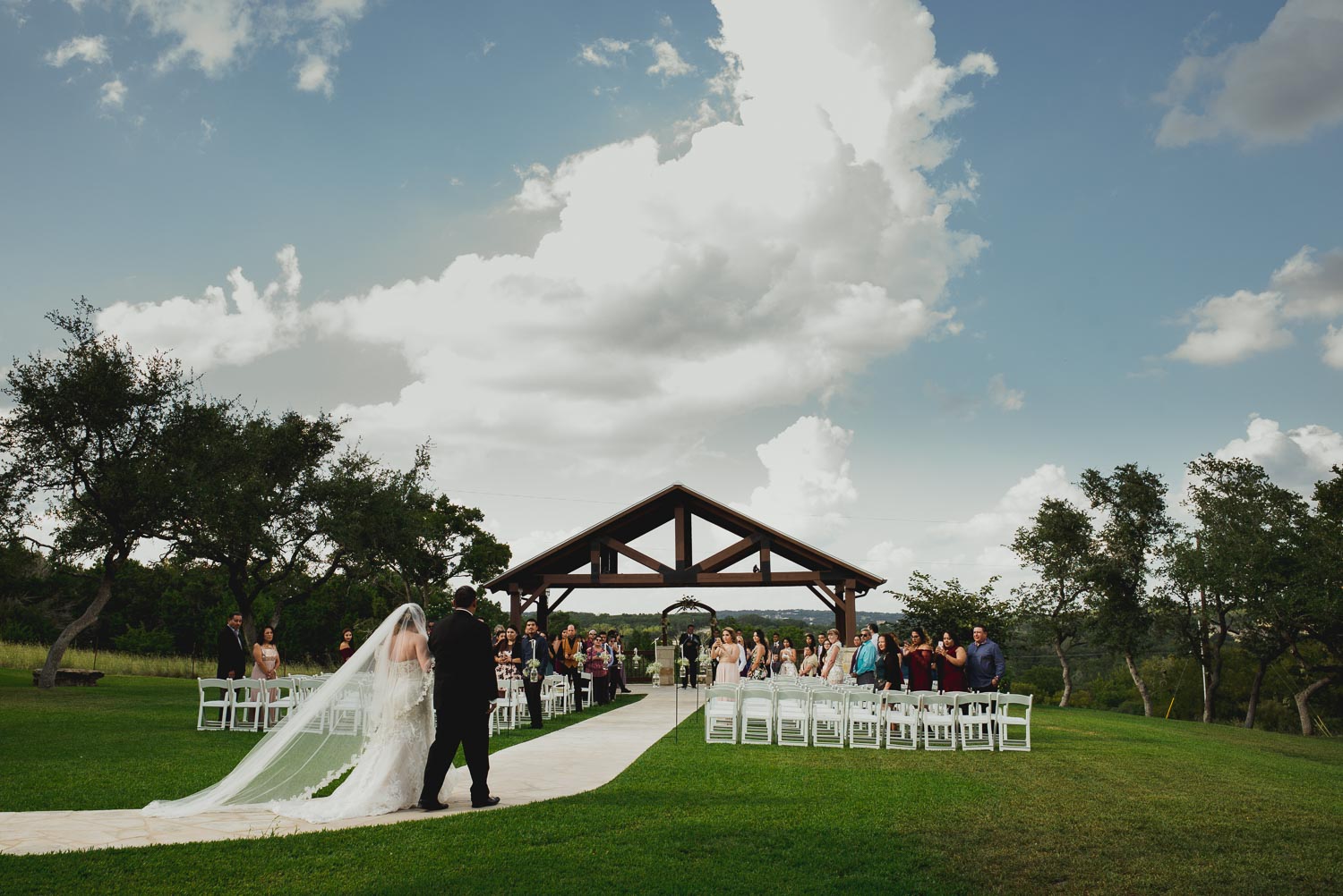 Bride walks down the aisle with her father at The Springs Event Venue Wedding Photos-Philip Thomas