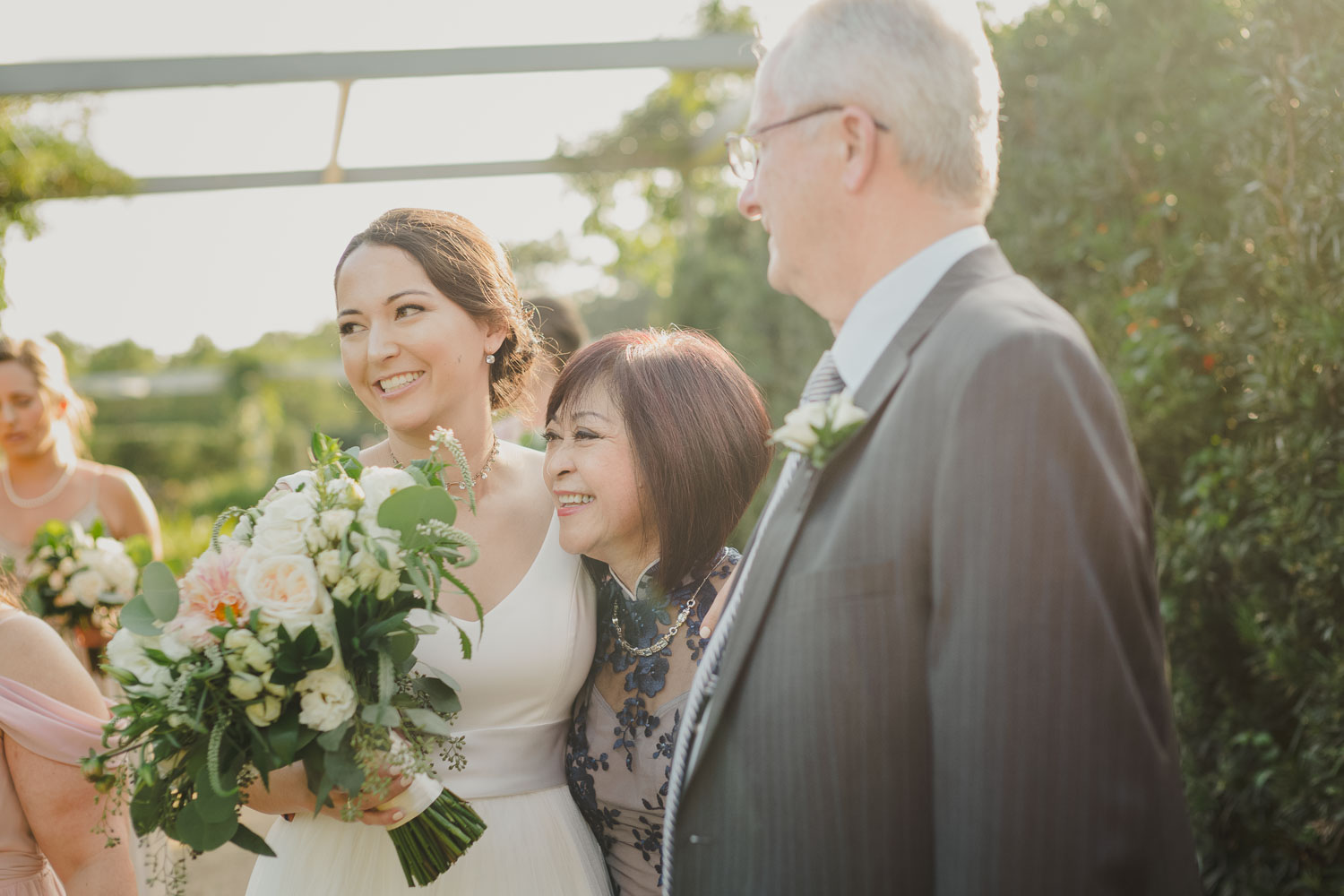 Moments before walking down the aisle, mother and father hug Cherie Flores Garden Pavilion Wedding Hermann Park Houston Texas-Philip Thomas