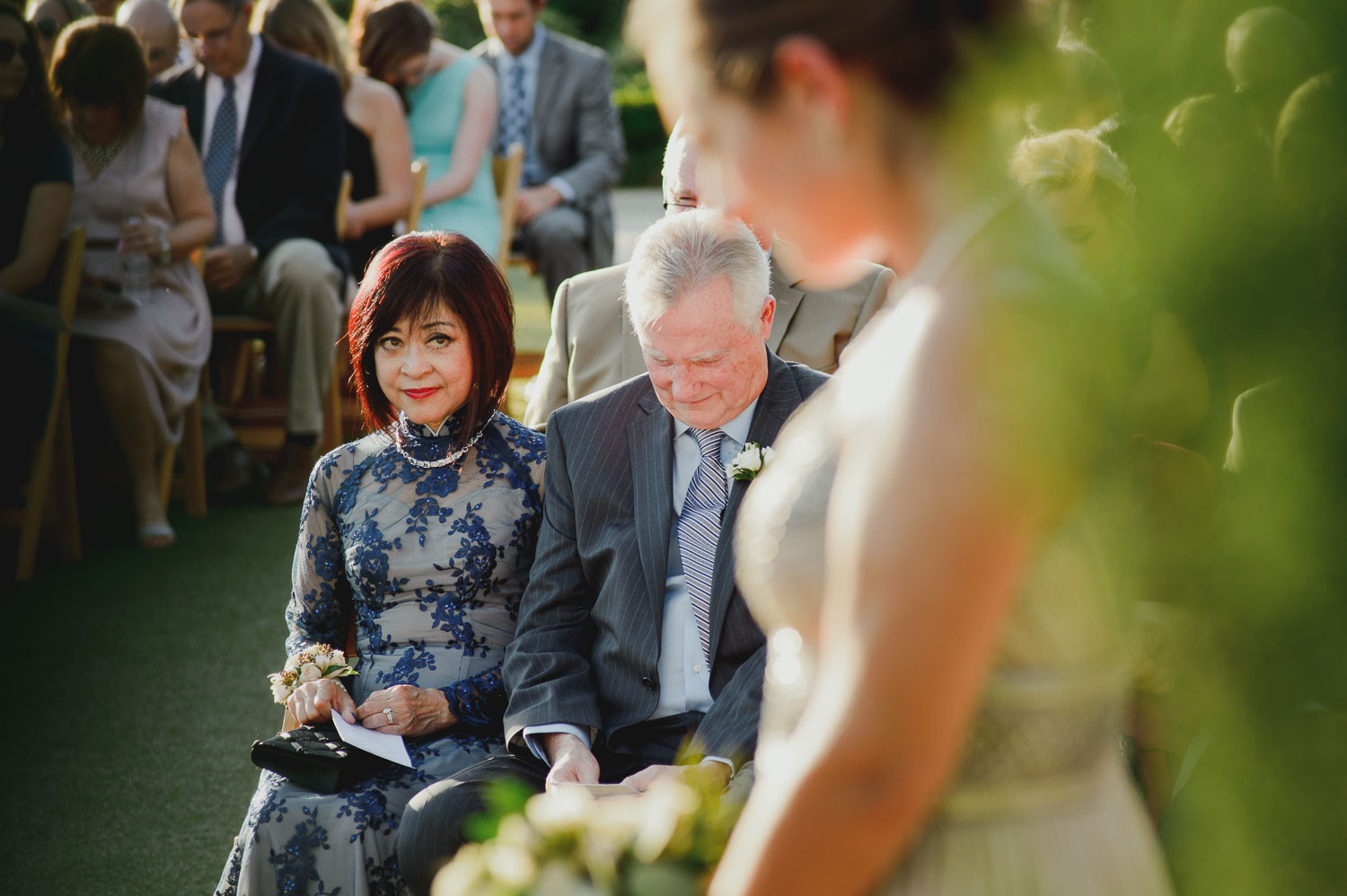 Mother and father watch their daughter marry during ceremony at Cherie Flores Garden Pavilion Wedding Hermann Park Houston Texas-Philip Thomas
