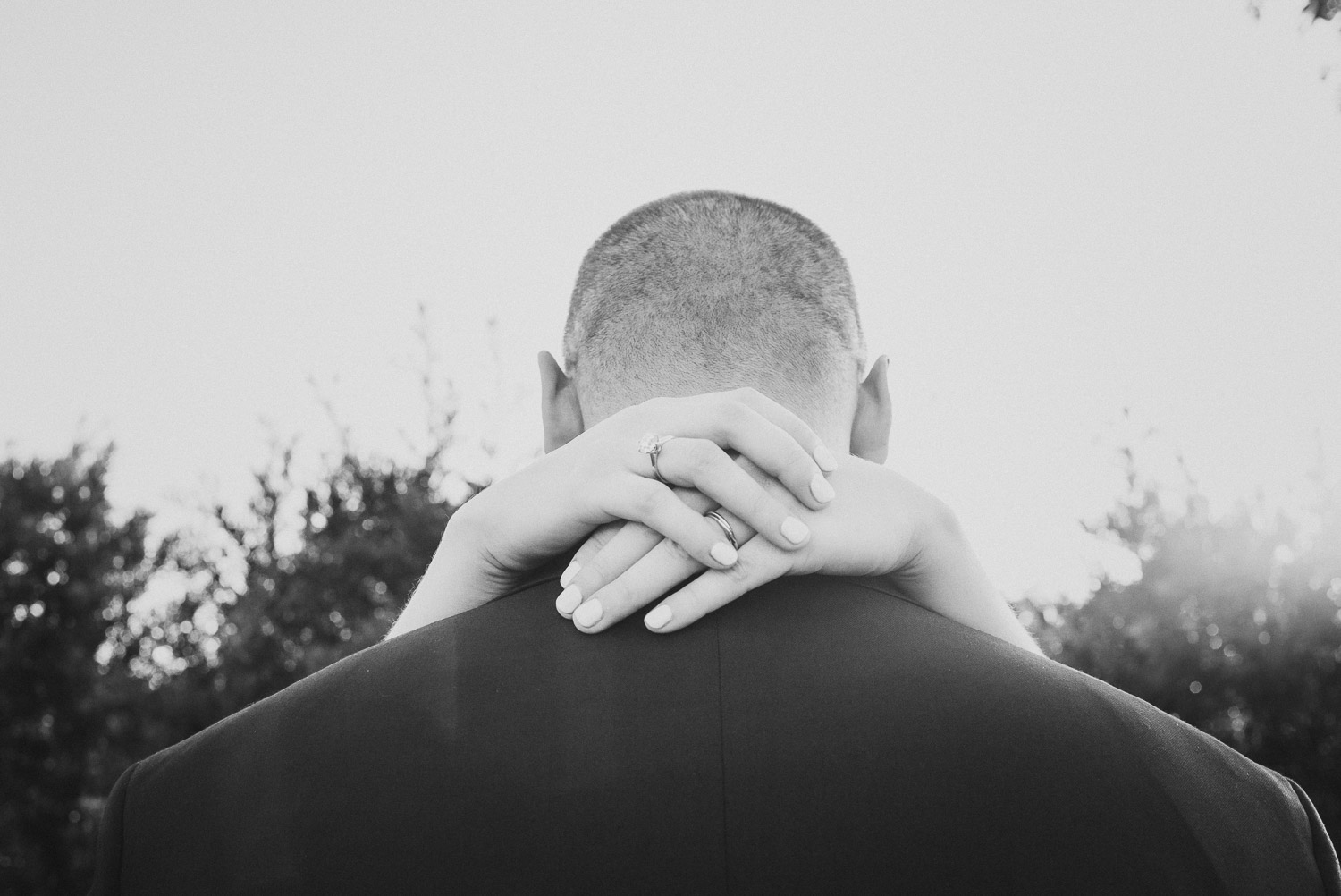 Wrapped hands round back of grooms head Cherie Flores Garden Pavilion Wedding Hermann Park Houston Texas-Philip Thomas