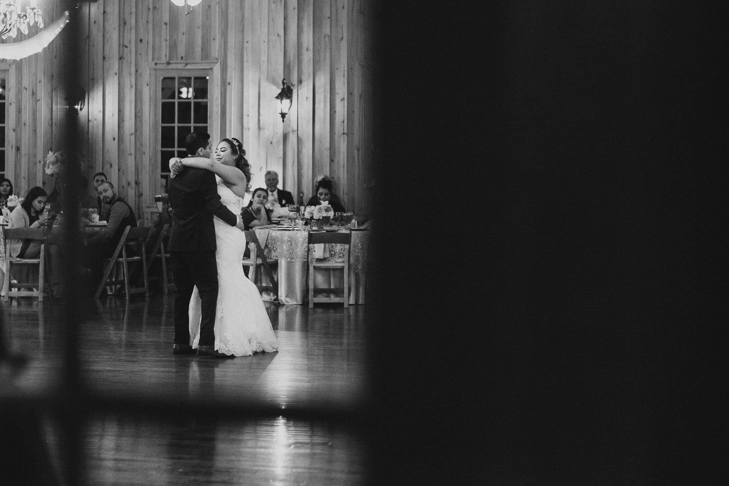Couples first dance photographed outisde through window at The Springs Event Venue Wedding Photos-Philip Thomas