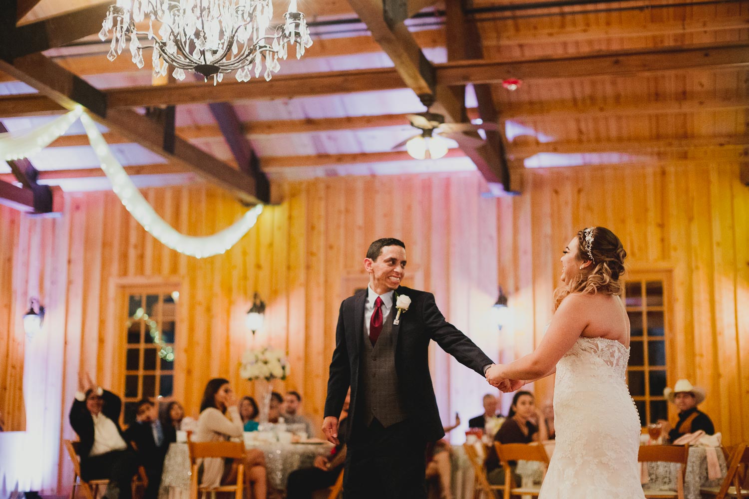 Coupel dance and groom looks back very happy toward his bride at the Springs Event Venue Wedding Photos-Philip Thomas