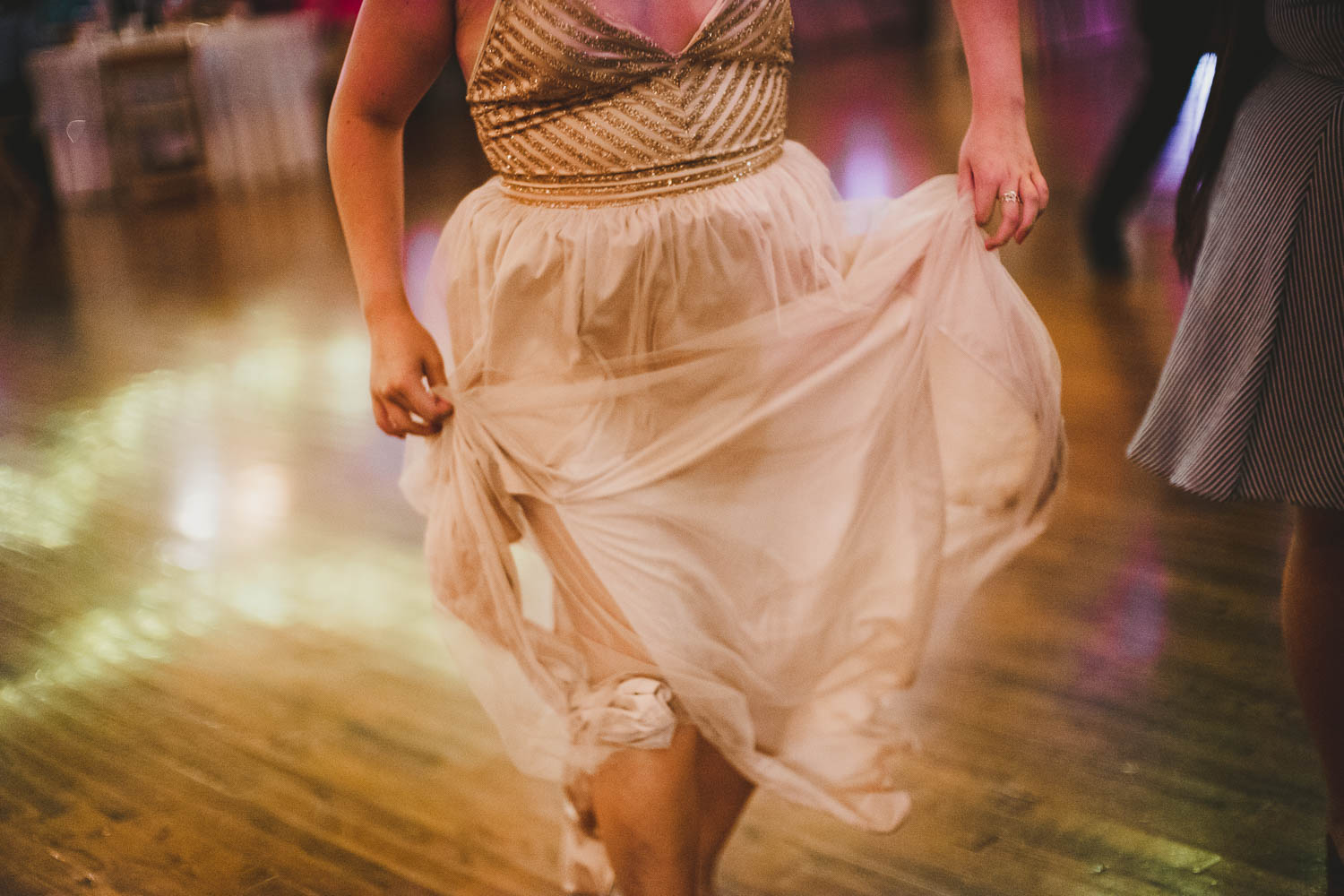 Slow shutter photo of bridesmaid dress at wedding reception dance floor -The Springs Event Venue Wedding Photos-Philip Thomas
