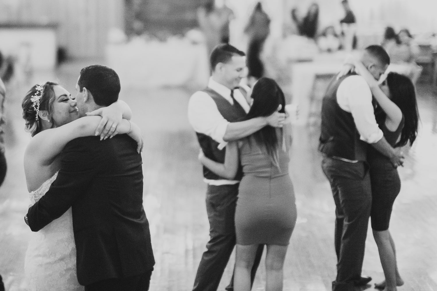 Three couples including bride and groom dance on reception floor The Springs Event Venue Wedding Photos-Philip Thomas