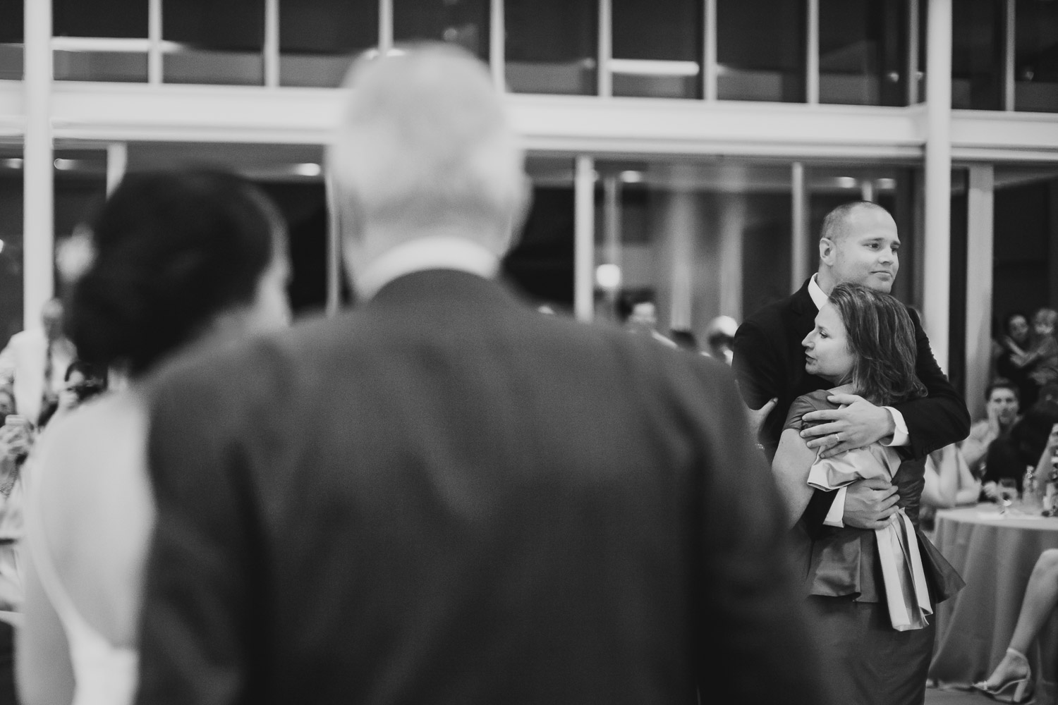 Justin th egroom dances with his mother first dance as bride and father observe at Cherie Flores Garden Pavilion Wedding Hermann Park Houston Texas-Philip Thomas