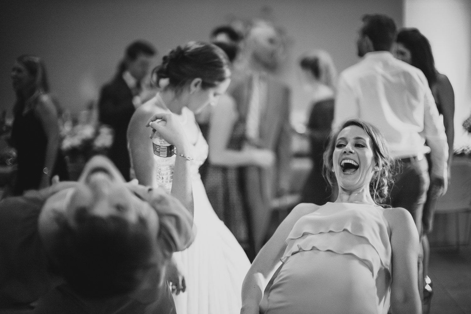 Bridesmaids having fun with guest at wedding reception -Cherie Flores Garden Pavilion Wedding Hermann Park Houston Texas-Philip Thomas