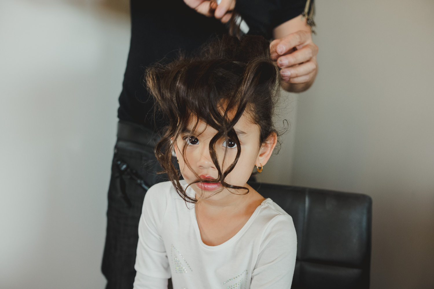 Flower girl has her hair styled at Paniolo Ranch Wedding Reception-Philip Thomas