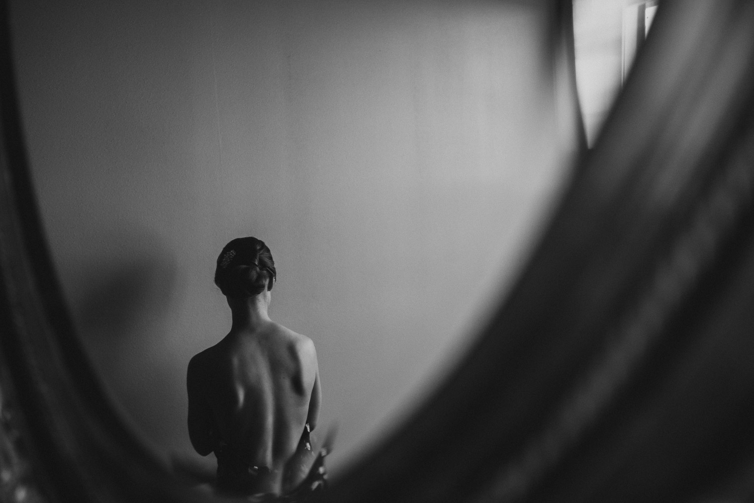 The beautiful back of a a bride as she waits to get ready Paniolo Ranch Wedding Reception-Philip Thomas