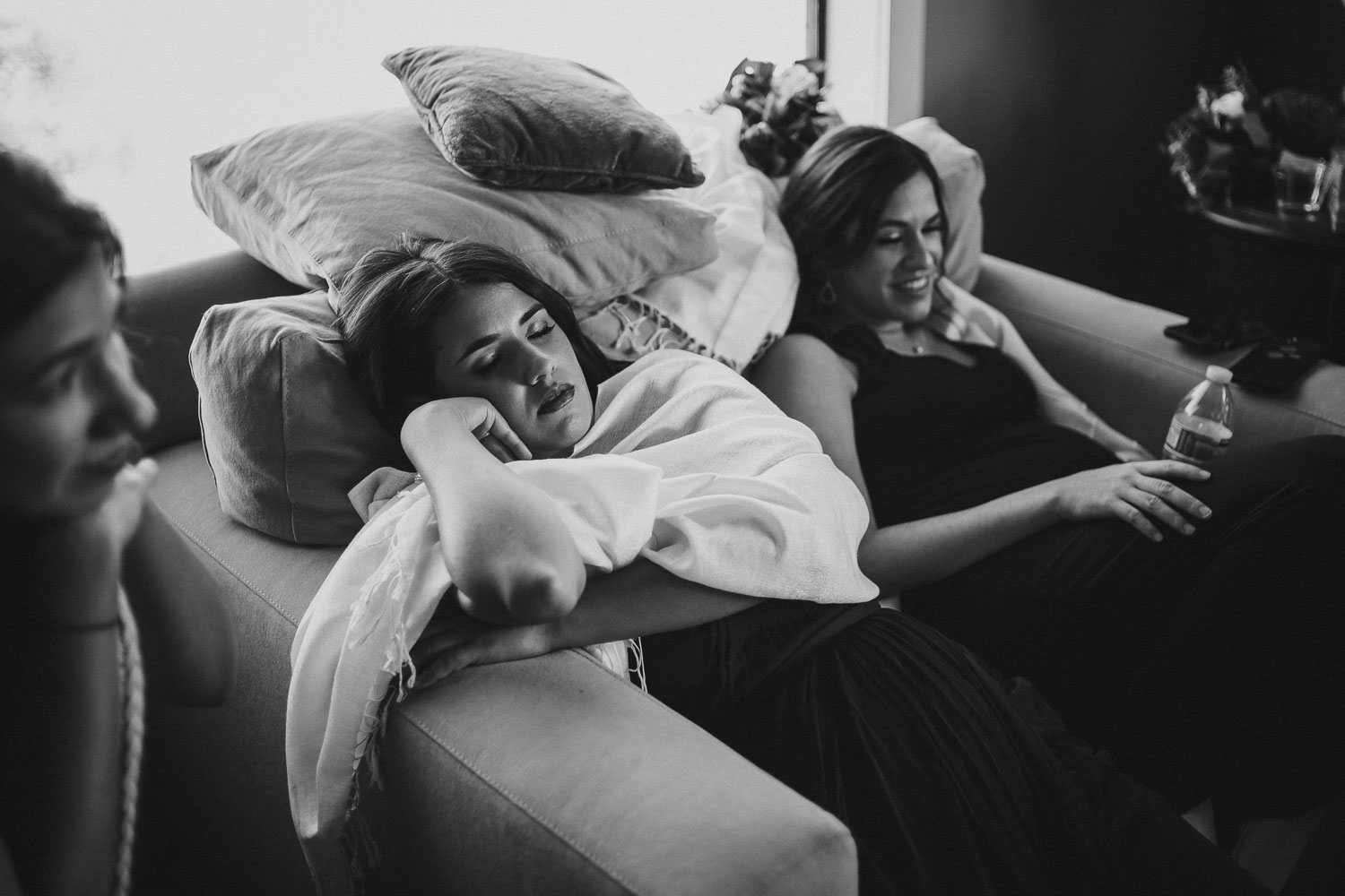 Sisters in law rest on a wedding day at Paniolo Ranch Wedding Reception-Philip Thomas