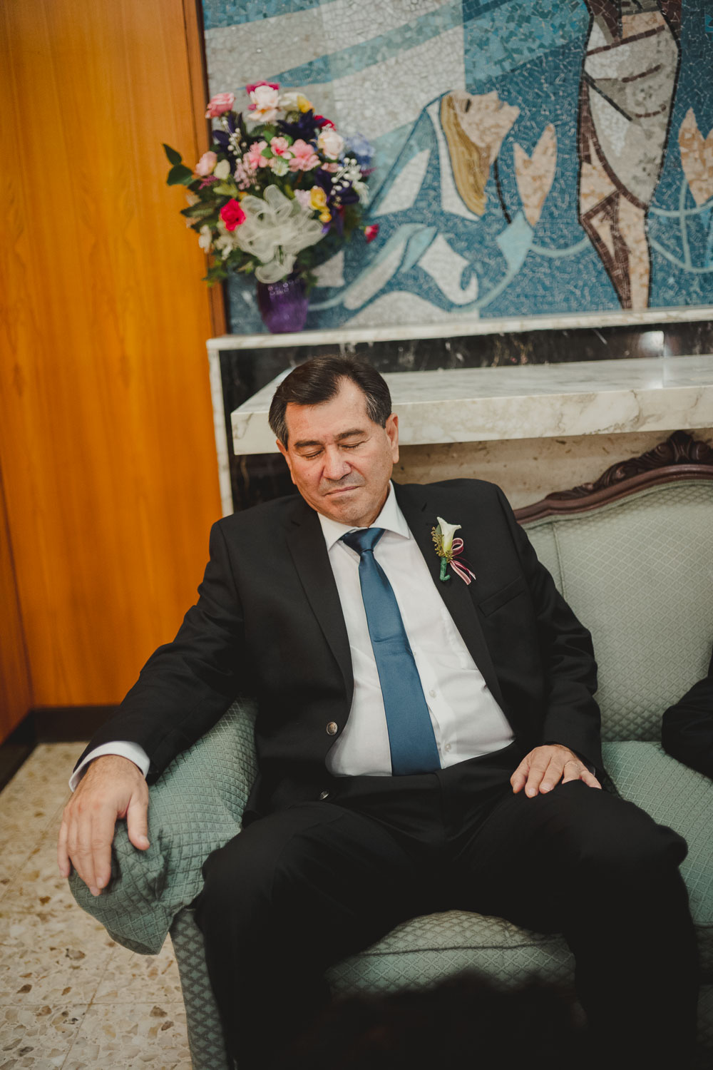 Father of the bride snoozes before the wedding ceremony at Immaculate Conception Chapel at Oblate School of Theology -Philip Thomas