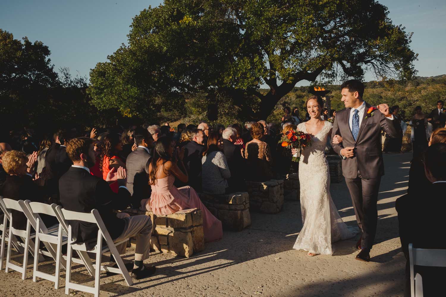 Just married couple walk down the aisle at Paniolo Ranch Wedding Reception-Philip Thomas
