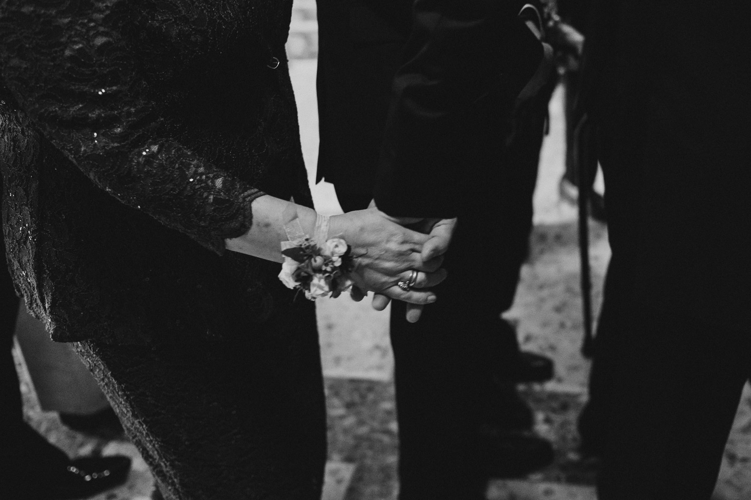 Mother and son, Alex, holds hands before the ceremony at Immaculate Conception Chapel at Oblate School of Theology -Philip Thomas