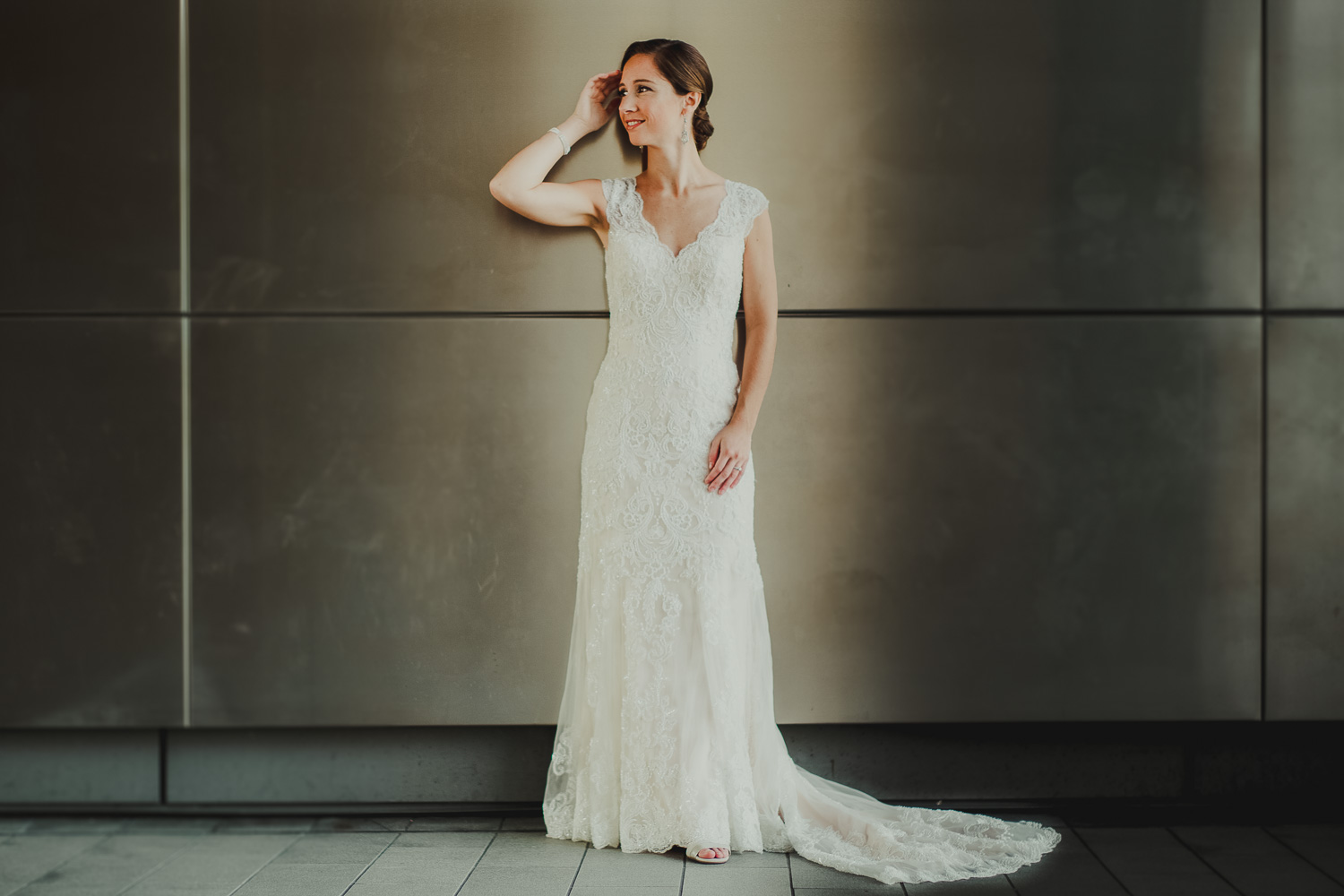 Bridal portrait captured against reflective wall at Cherie Flores Garden Pavilion -Philip Thomas