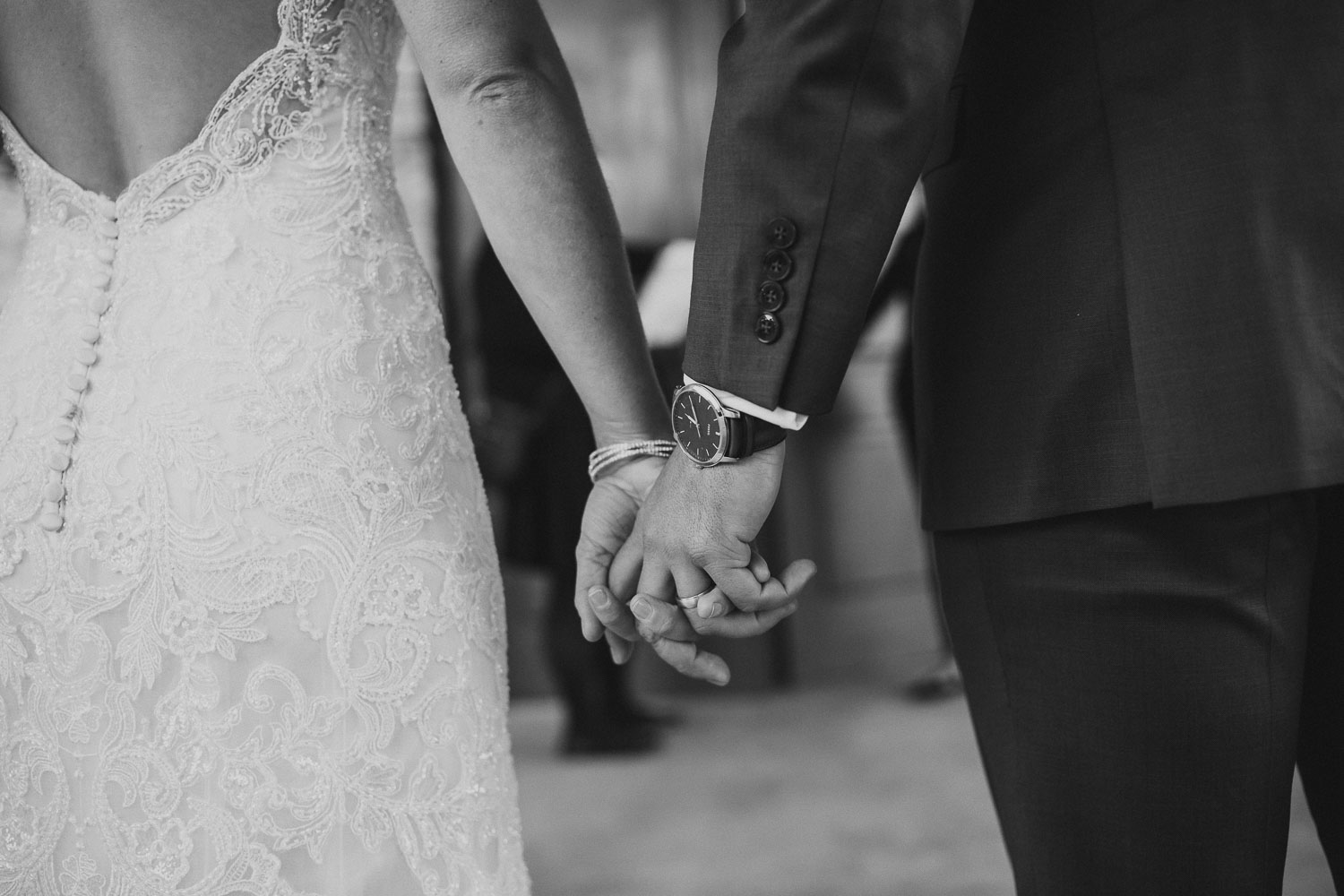 Bride and groom hold hands at Paniolo Ranch Wedding Reception-Philip Thomas