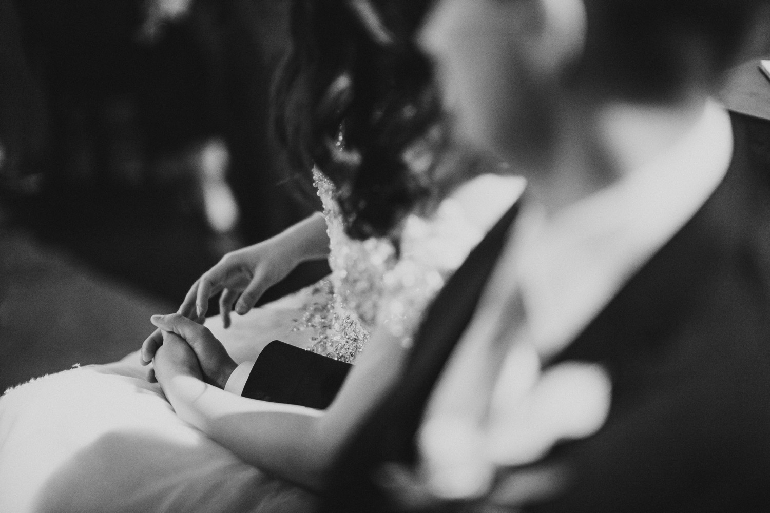 Couple hold hands at Paesanos 1604 Wedding Reception-Philip Thomas