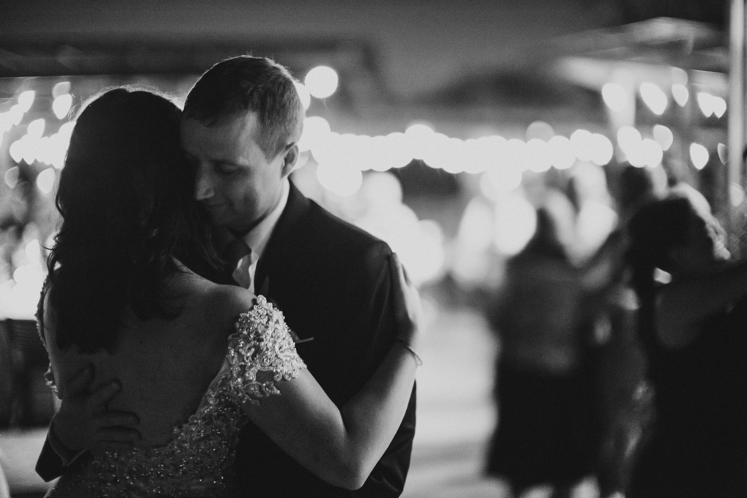 Bride and groom hold each other closely during dancing at Paesanos 1604 Wedding Reception-Philip Thomas