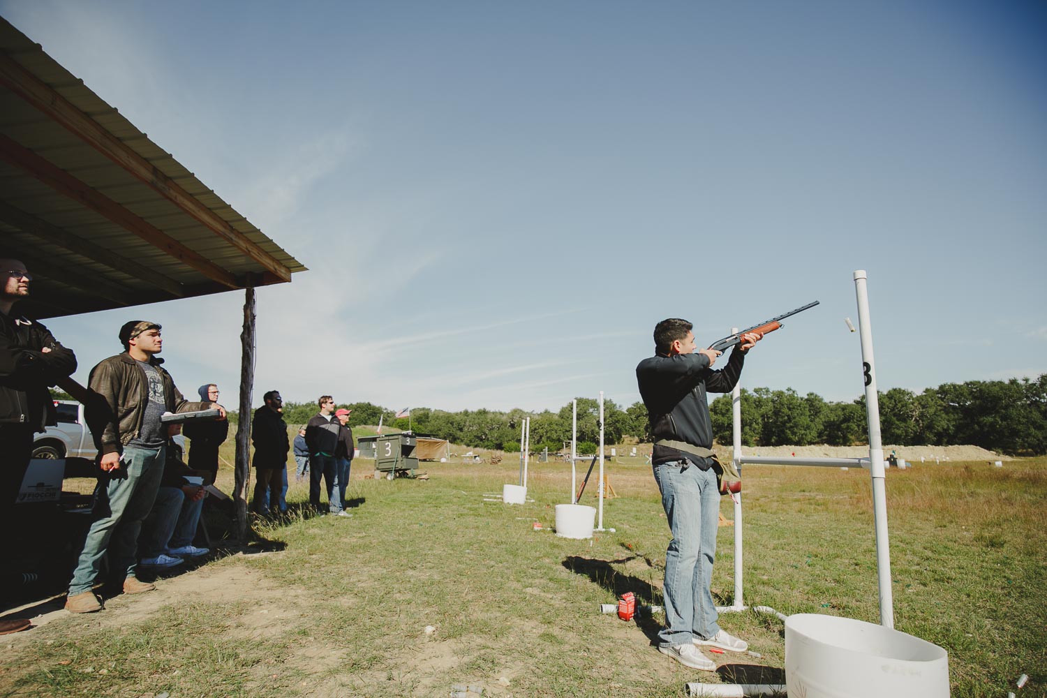 The groom on his wedding day morning with groomsmen at a Hillco Gunsmith gun range