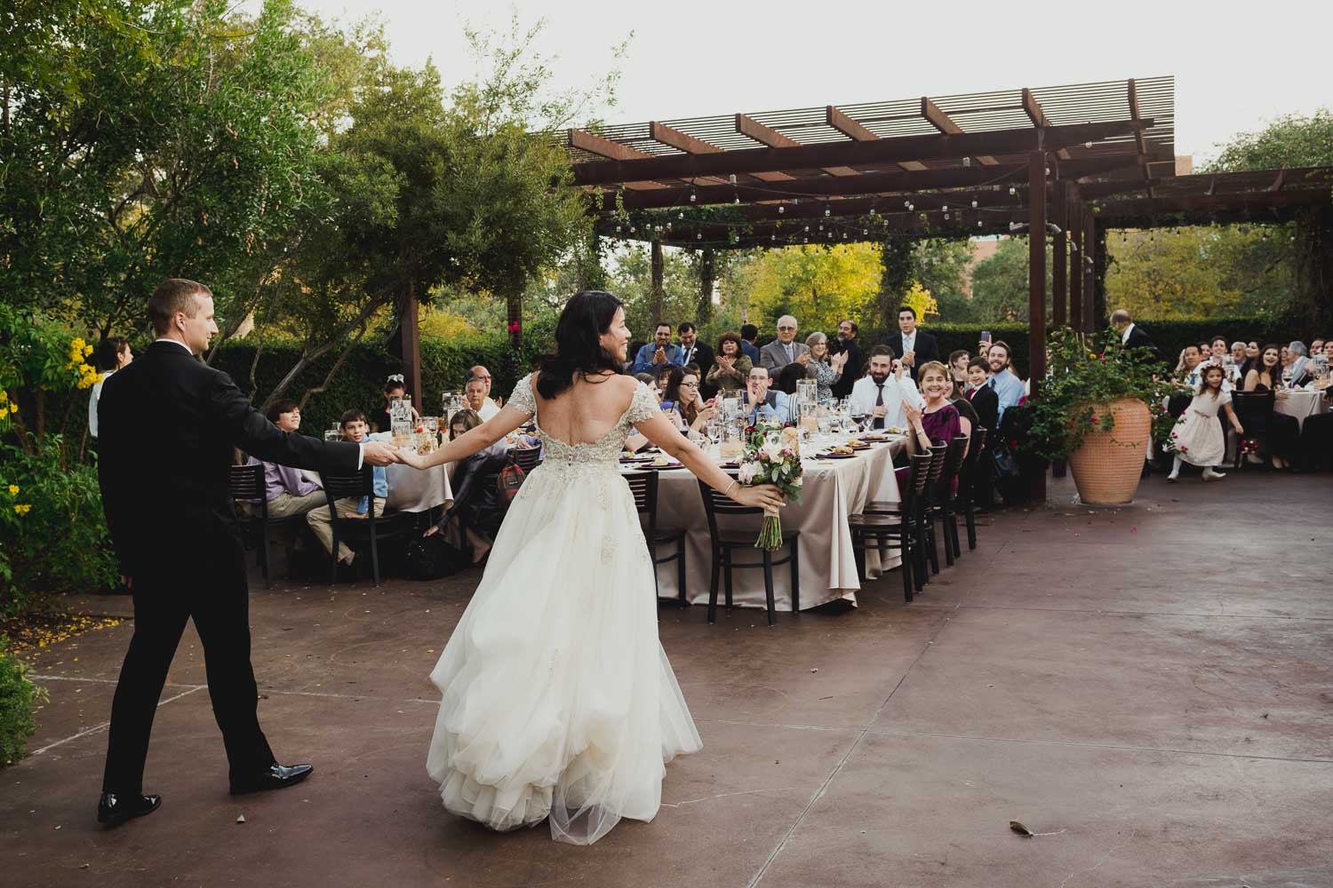 Bride and groom make their entrance into wedding reception Paesanos 1604 Wedding Reception-Philip Thomas L1001181