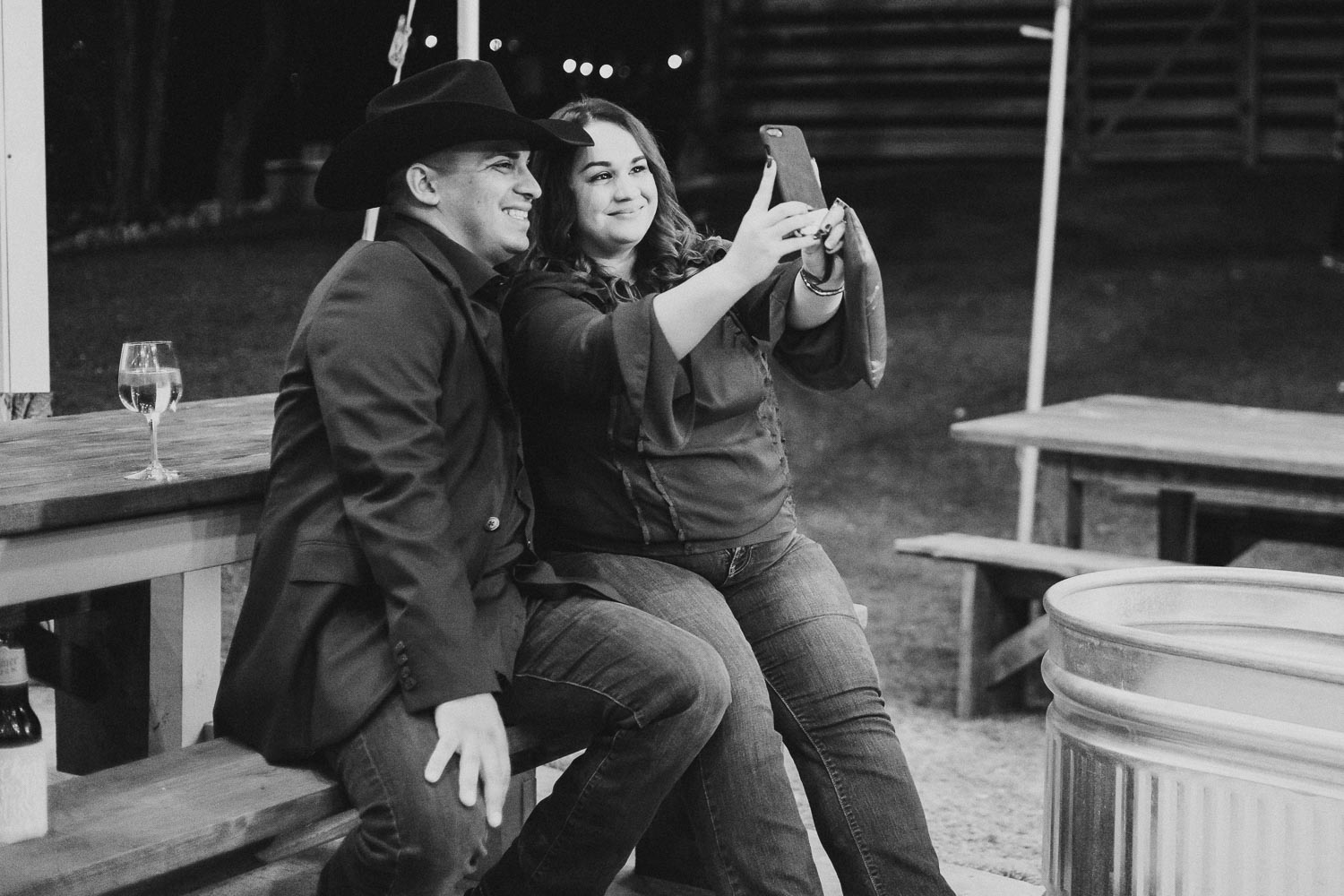 A couple take a selfie at a rehearsal dinner Liney moon DRIPPING SPRINGS _ BRANDI + AJ-08