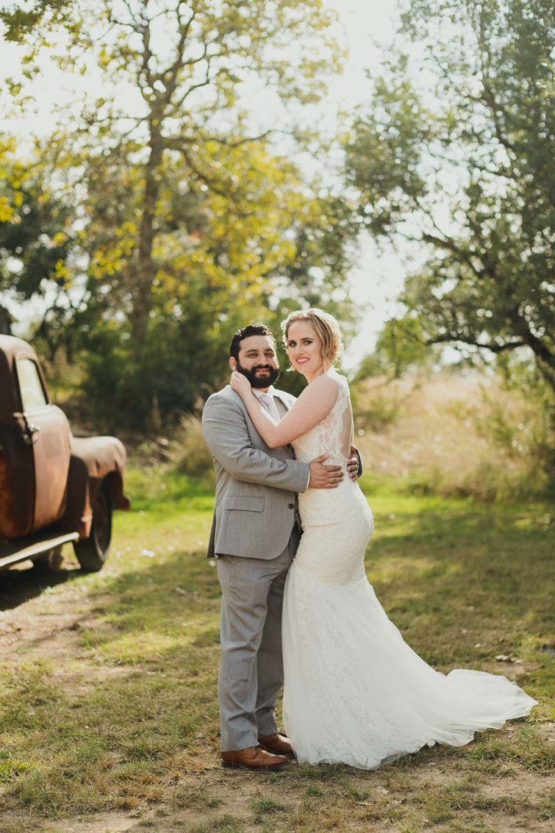 Couple pose for the camera at RUSTIC BARN WEDDING at VISTA WEST RANCH DRIPPING SPRINGS _ BRANDI + AJ-27