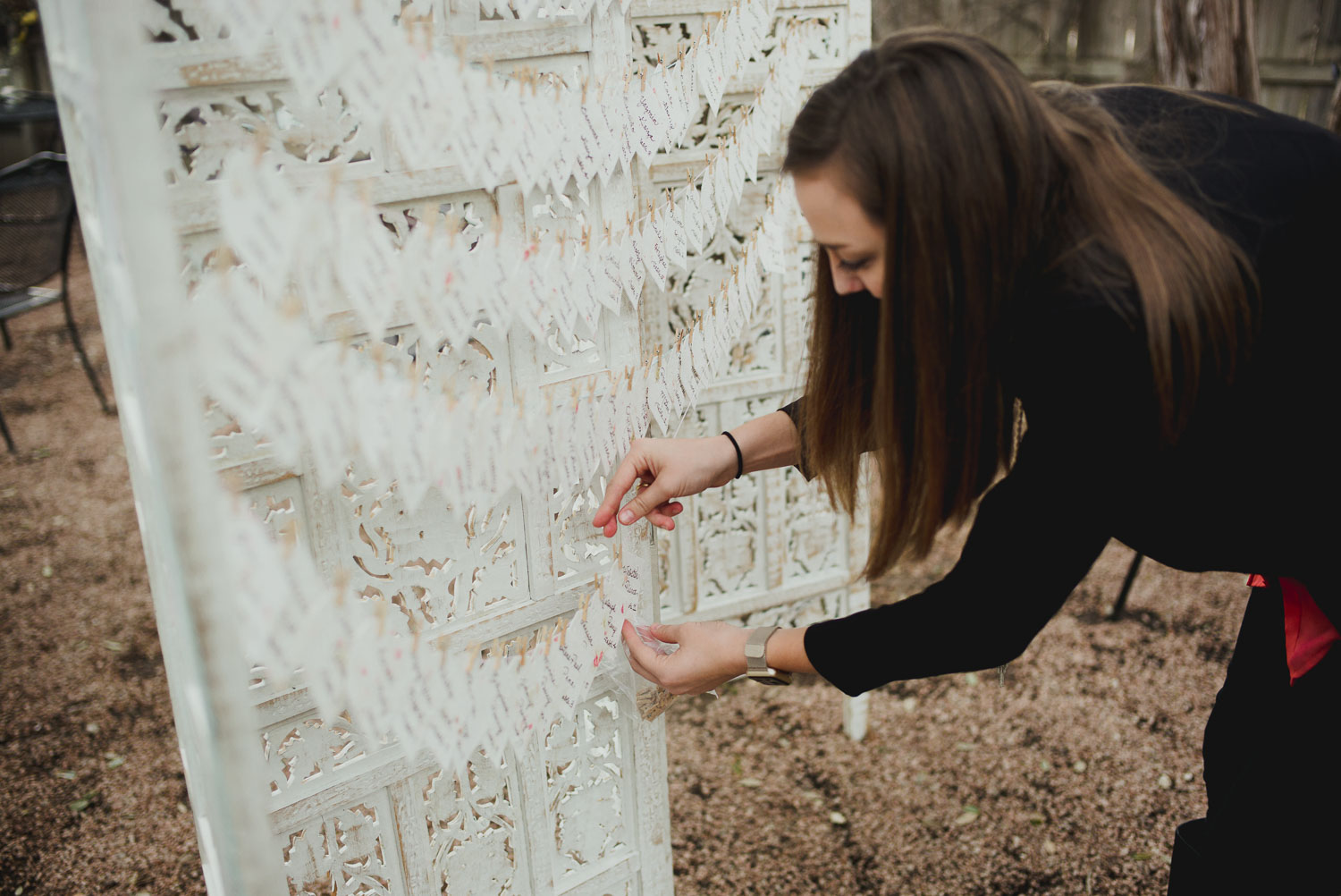 Daughter of the wedding planner readying the reception with table numbers RUSTIC BARN WEDDING at VISTA WEST RANCH DRIPPING SPRINGS _ BRANDI + AJ-30