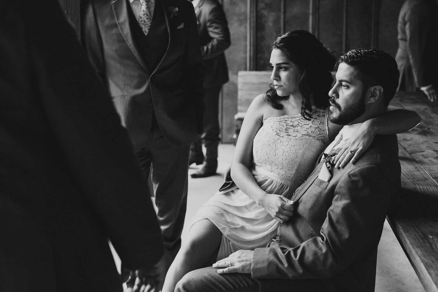 Bridal party couple sit in beautiful light at RUSTIC BARN WEDDING at VISTA WEST RANCH DRIPPING SPRINGS _ BRANDI + AJ-31